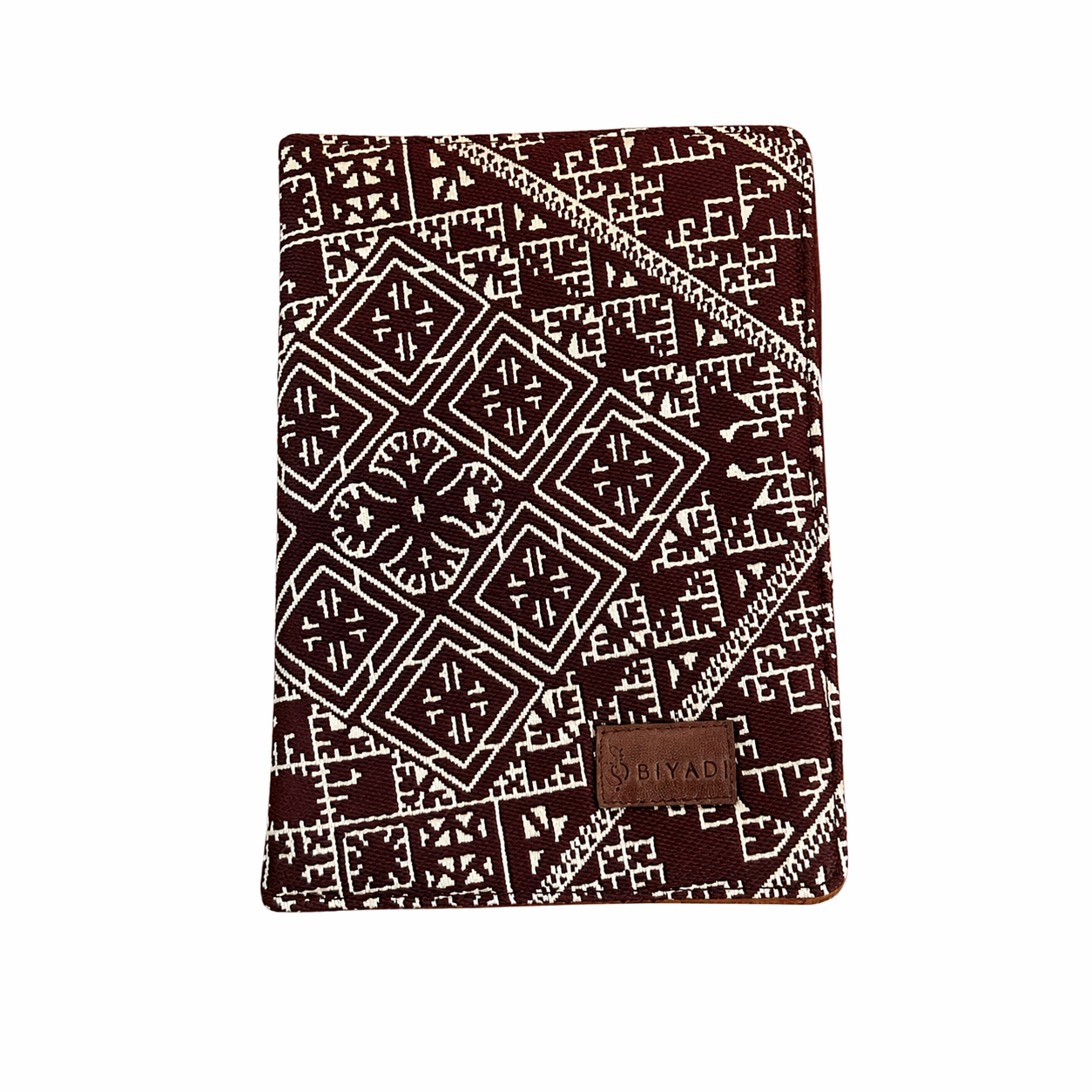 Carnet de notes Tarz burgundy Biyadi Collection avec couverture en tissu tissé au Maroc, motif géométrique noir et écru.