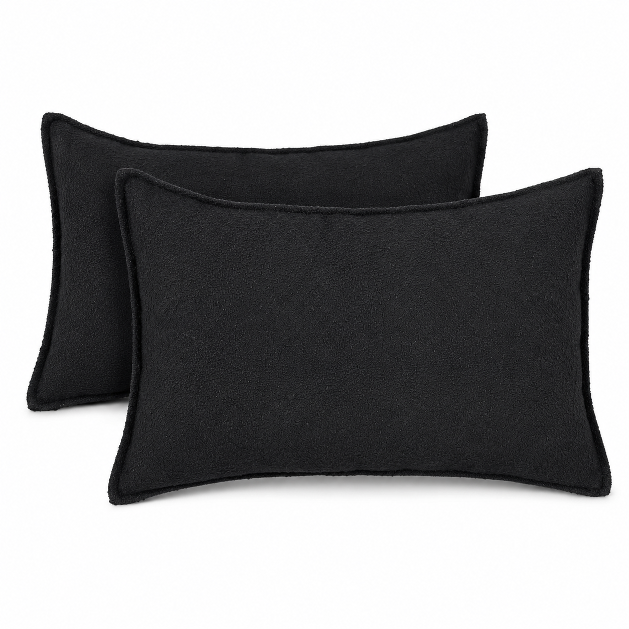 Coussins rectangulaires en tissu bouclette noir, texture douce et élégante