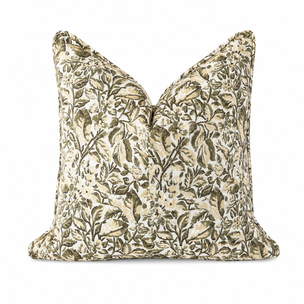 Coussin décoratif fleuri vert et beige avec finition passepoilée, présenté sur fond blanc.