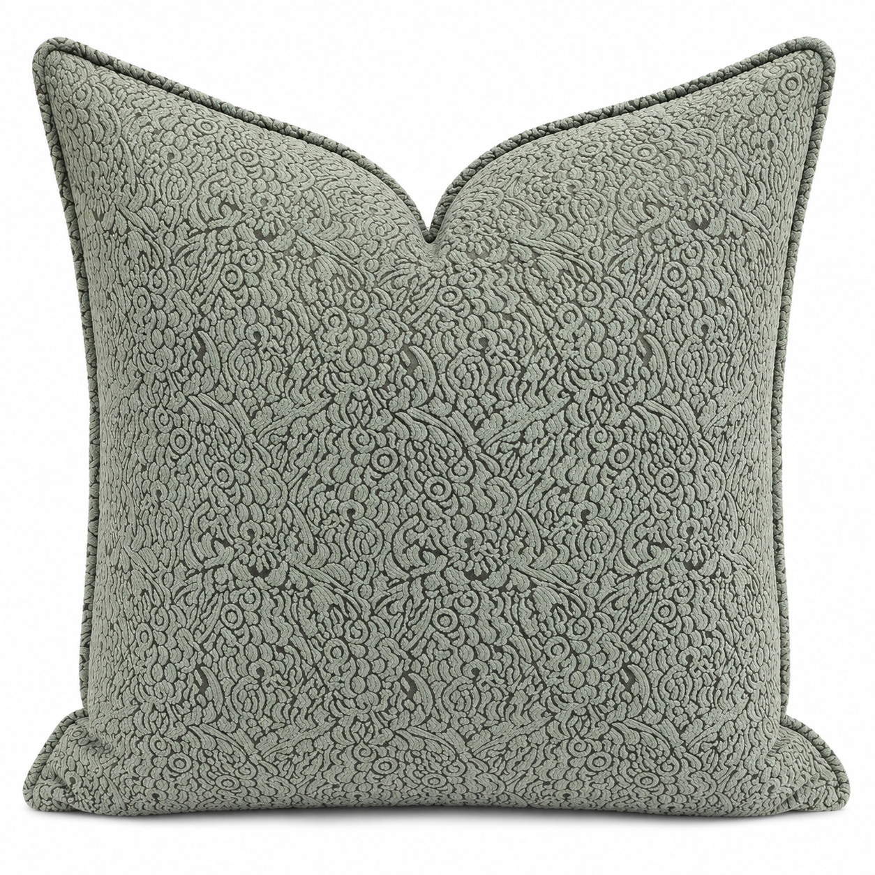 Coussin décoratif vert à motif floral en relief, tissu marocain élégant pour salon chic et contemporain.