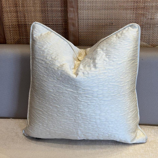 ussin décoratif uni ivoire en tissu marocain texturé, finition élégante et haut de gamme.