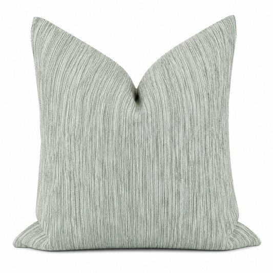 Coussin décoratif vert  texturé à effet linéaire, au style moderne et apaisant .