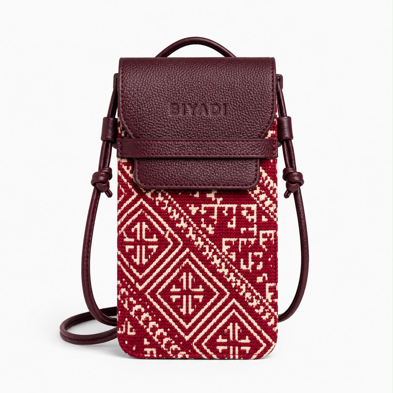 Porte téléphone en tissu marocain rouge à motif géométrique avec rabat et finitions en cuir véritable, fabriqué au Maroc