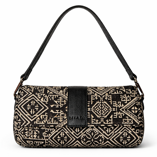 Sac baguette noir en tissu marocain à motif géométrique avec rabat et finitions en cuir noir