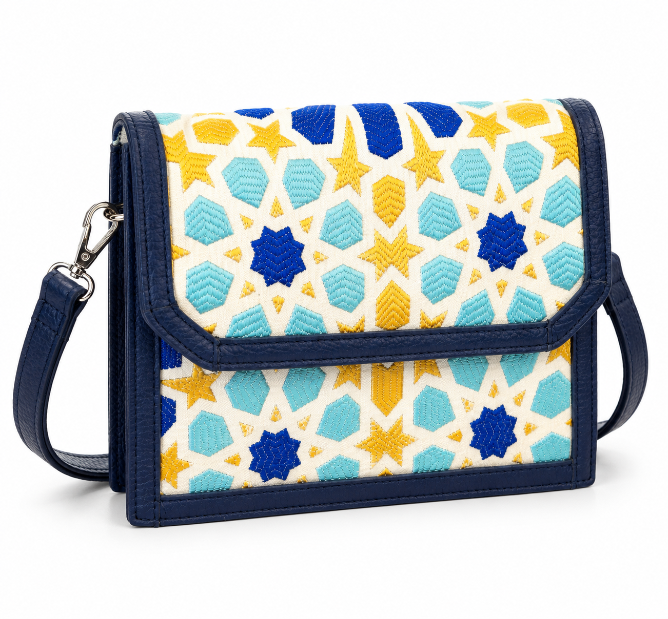 Sac bandoulière Zellij en tissu marocain tissé, avec motifs géométriques bleu, jaune et turquoise inspirés des mosaïques marocaines, finitions  cuir bleu marine et bandoulière réglable.